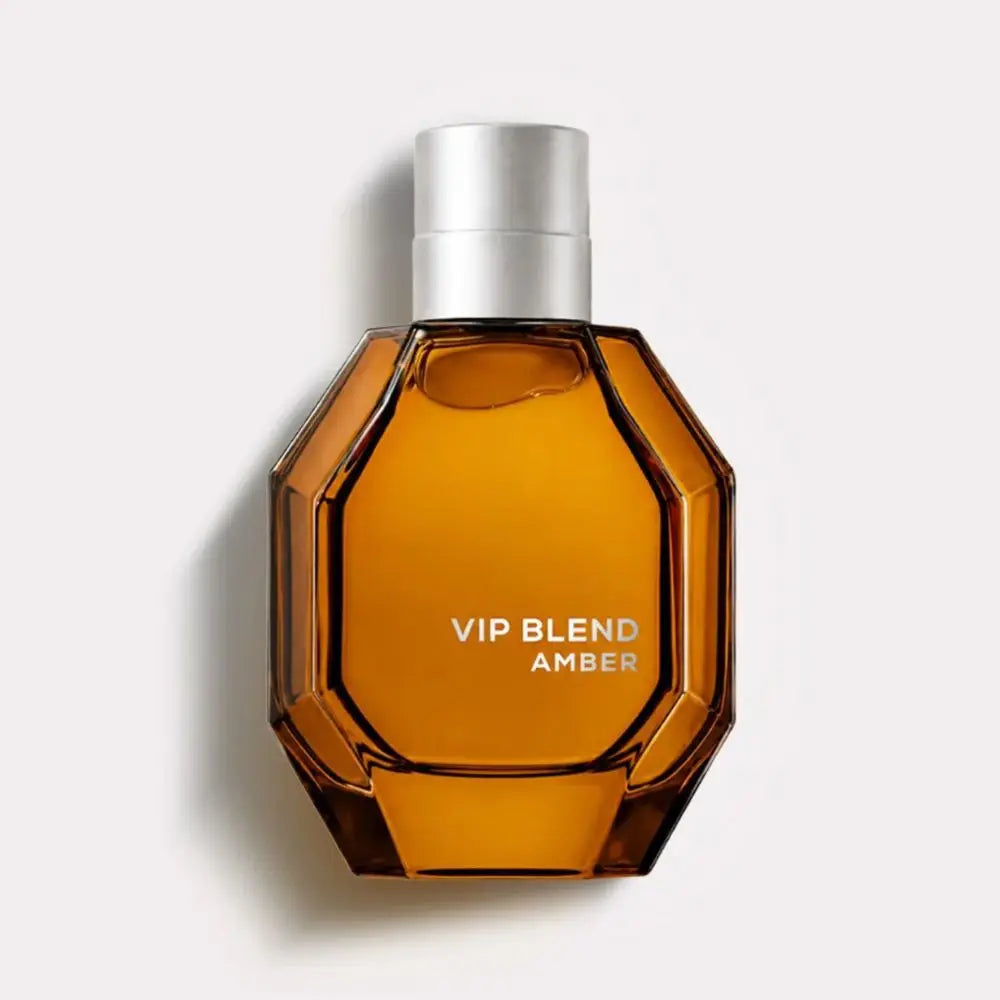 Amber-colored perfume bottle labeled 'VIP Blend Amber' on a light gray background